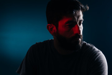 Dramatic portrait of bearded man. Concept of sadness, depression, alert