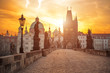 Scenic view of Charles Bridge (Karluv Most) and Lesser Town Tower Prague symbol at sunrise, Czech Republic