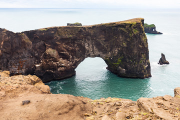 Poster - lava arch on Dyrholaey peninsula in Iceland