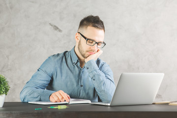 Wall Mural - Handsome businessman sleeping at workplace