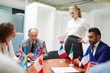 © pressmaster - Young Russian representative presenting her speech to foreign colleagues at political event