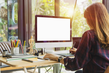 Leinwandbilder - Young creative designer working at office