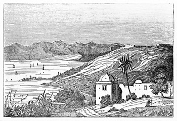 Overall ancient view of Algiers bay with arabian building in foreground, hills, little town and Mediterranean Sea in background. By unidentified author published on Magasin Pittoresque Paris 1834