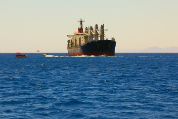 Cargo ship entering the harbor at the Red Sea