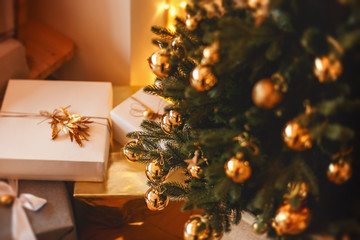 Lovely christmas tree with beautifuly packed presents boxes under it