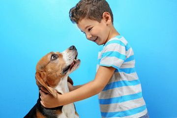 Sticker - Cute boy with dog on color background