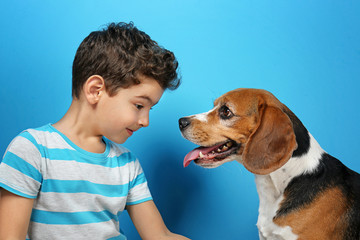 Sticker - Cute boy with dog on color background