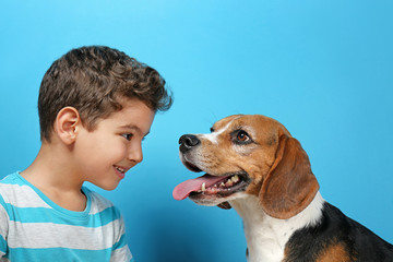 Sticker - Cute boy with dog on color background