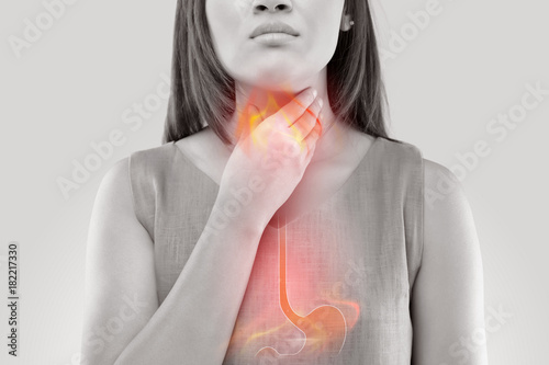 Fotomural Woman Suffering From Acid Reflux Or Heartburn-Isolated On White Background