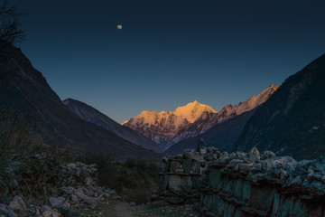 Langtang valley moonrise over mountain