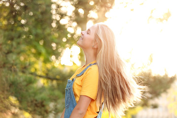 Wall Mural - Portrait of cute teenager girl outdoors