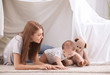© Africa Studio - Young mother and cute baby playing in tent at home