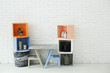 © Africa Studio - Modern TV stand against light brick wall