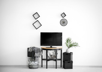 Poster - Modern TV on stand against light wall background