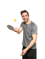 Wall Mural - Young man with tennis racket and ball on white background