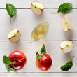 Fresh apples and vinegar on wooden table. Concept - healthy food from your garden.