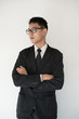 © teerapong - Asian businessman folded arm look away isolated on white background