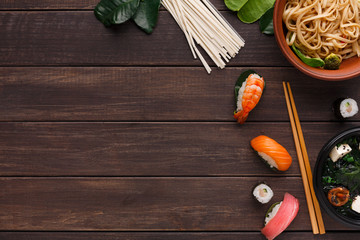 Asian food on wooden background, copy space