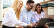 © NDABCREATIVITY - Happy colleagues casual chat at the office