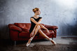 © imynzul - Super slim ballerina in a black dress is posing in the studio