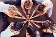 © uv_group - Group of sporty happy people sitting on the gym floor in a circle together, resting and meditating after yoga class, talking about healthy life with instructor indoors. Healthy lifestyle concept