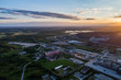 © nikwaller - Aerial view Oil refinery with a background of mountains and sky at sunset. Aerial photography. Kohtla-Järve city, Estonia, Ida-Virumaa.