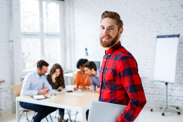 Wall Mural - Portrait of hipster student in classroom