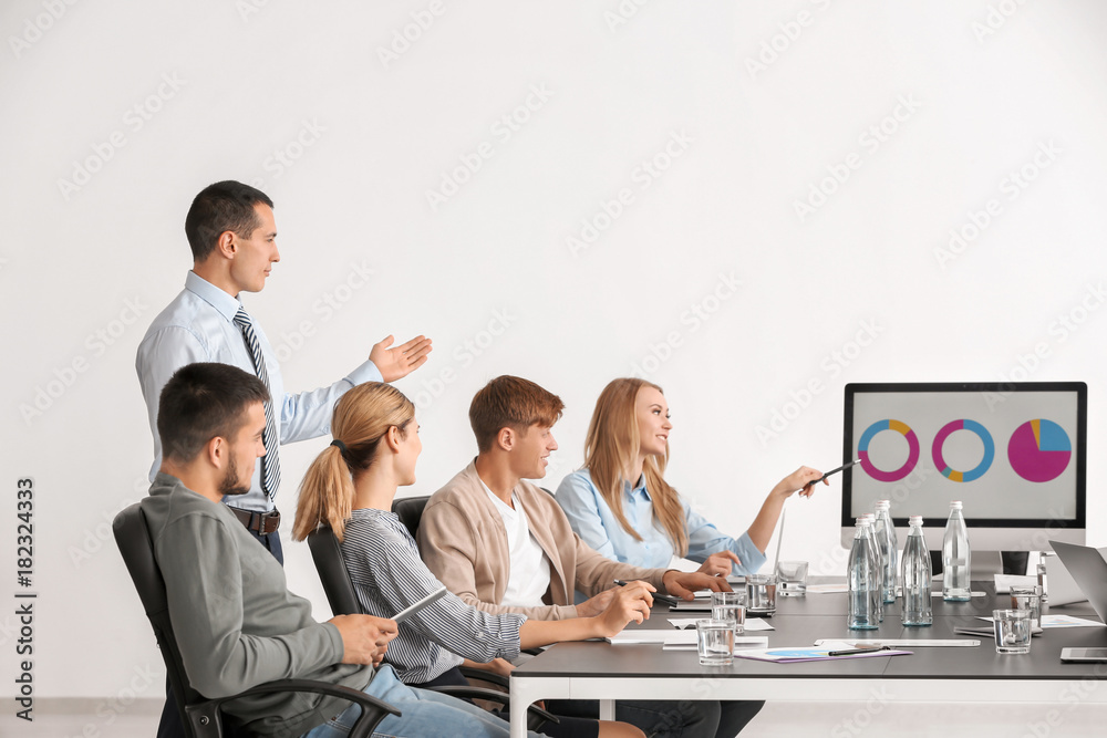 Group of people with business trainer at seminar