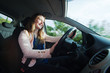 © Igor Dutina - Young woman driving a car