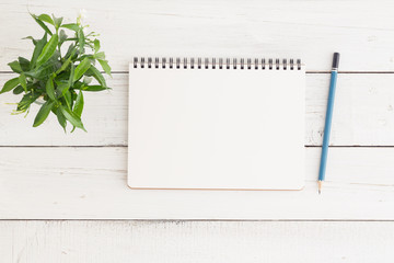 Wall Mural - flat lay photo of blank whtie notebook on whtie table