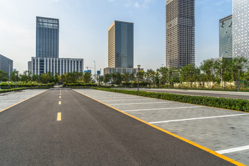 Canvas Print - empty car park with downtown city space background