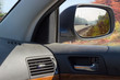 © An-T - Reflected highway in car side rear-view mirror in autumn