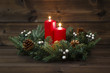 Second Advent - Decorated Advent wreath with two red burning candles on a wooden background