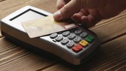 Canvas Print - Closeup shot of person using contactless payment with credit card