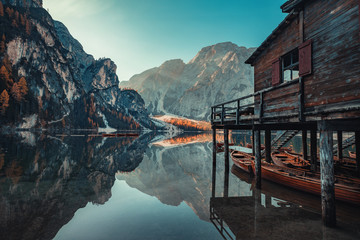 Wall Mural - boats on the braies lake ( pragser wildsee ) in dolomites mountains, sudtirol, italy