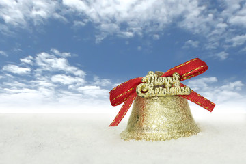 Wall Mural - christmas golden bells with red ribbons on the snow