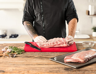 Poster - Man cooking meat steak on kitchen