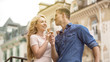 © motortion - Cheerful couple having fun on date, eating sweet ice cream together, romance