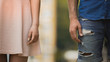 © motortion - Young male and female standing next to each other, couple breaking up, closeup