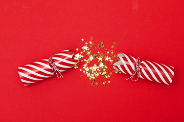 Wall Mural - Christmas crackers on a red background