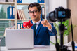 © Elnur - Businessman recording a video for vlog