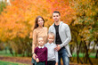 © travnikovstudio - Portrait of happy family of four in autumn day