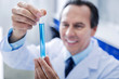 © zinkevych - Chemical analysis. Selective focus of a test tube with blue liquid being used for scientific analysis in the lab
