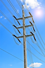 Wall Mural - electricity post in blue sky