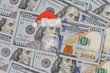 Benjamin Franklin in a Santa Claus hat on a bill. Christmas decorations