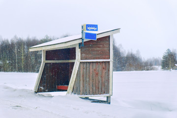 Poster - Wooden bus stop in winter countryside in Lapland