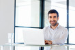 © Sergey Nivens - Handsome businessman working at computer