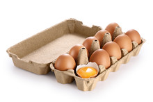 Carton Egg Box With Eggs Isolated On White Background. Broken Egg, Yolk.
