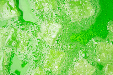 green soda water juice cold drink fruit with ice and bubble for background design hi resolution deta