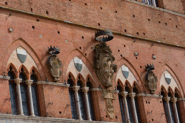 Wall Mural - Architectural detail of the Palazzo Pubblico at the Piazza del Campo in Siena, Italy, Europe